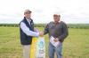 Colin Edmonson, LongReach congratulates Shawn Rayson, Princess Royal Station, Burra on winning 1t certified Scout wheat seed